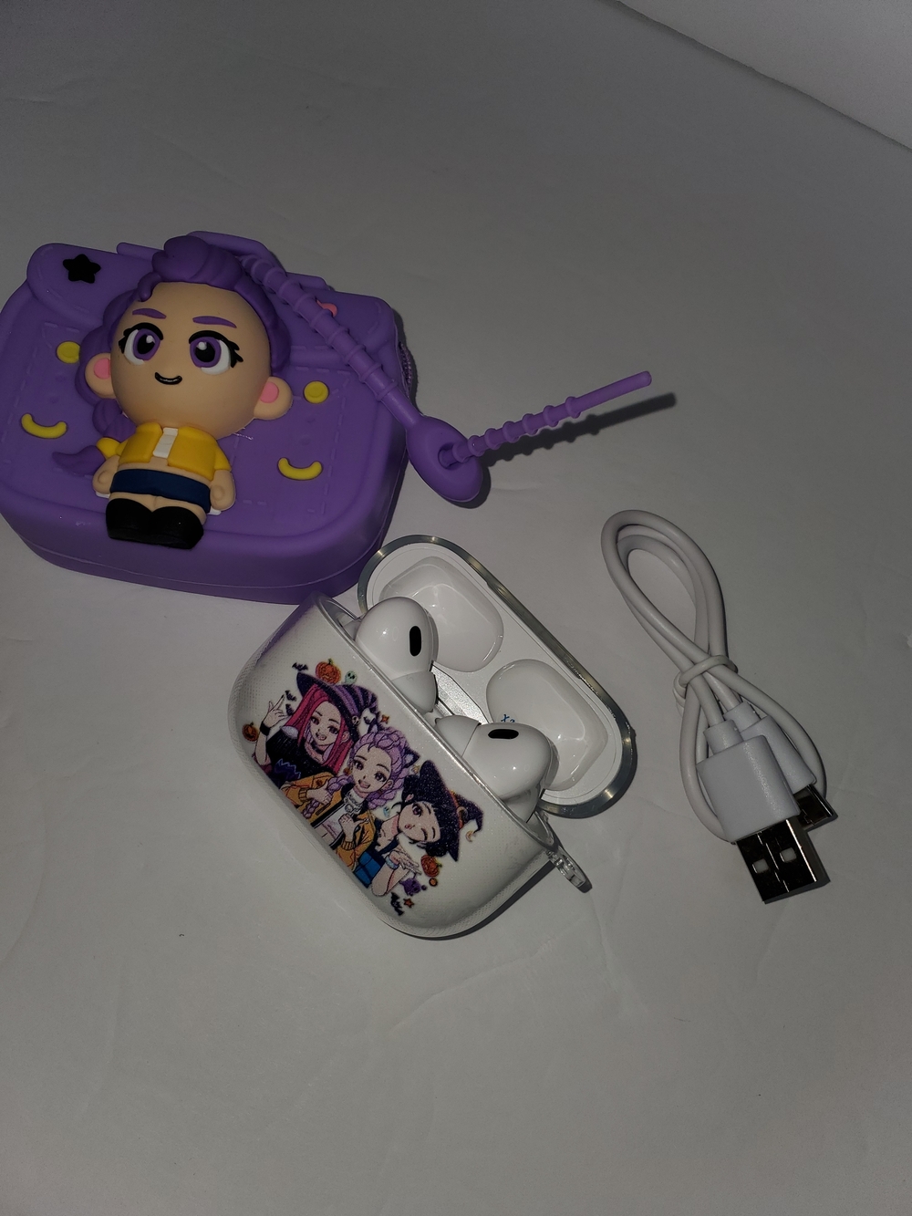 K-Pop Huntrix wireless headphones with 3D character silicone case and charging c